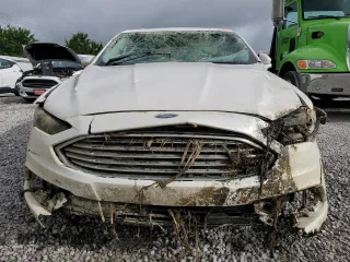 2017 Ford Fusion Titanium z VIN 3FA6P0K93HR227511, wystawiony jako Copart lot #60719505 z przebiegiem Nie podano mil oraz Szkoda całkowita • Salvage title. Historia ofert i sprzedaży dostępna na DreamBid. Obrazek 5.