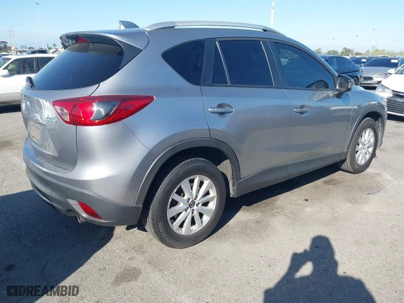 2013 Mazda CX-5 Touring with VIN JM3KE2CE3D0123138, listed as a IAAI auction lot 41818678 with 173,909 mi miles. Bid and sale history available at carsss.com. Image 4.