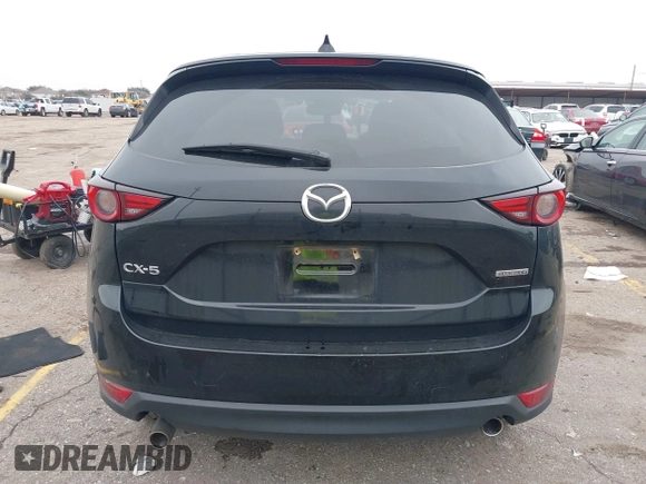 2020 Mazda CX-5 Grand Touring with VIN JM3KFADM8L0811910, listed as a IAAI auction lot 41446214 with 57,849 mi miles. Bid and sale history available at carsss.com. Image 17.
