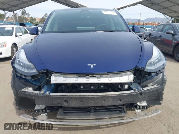 2022 Tesla Model Y Long Range with VIN 7SAYGDEE0NA019067, listed as a IAAI auction lot 41645198 with 49,336 mi miles and . Bid and sale history available at DreamBid. Image 13.