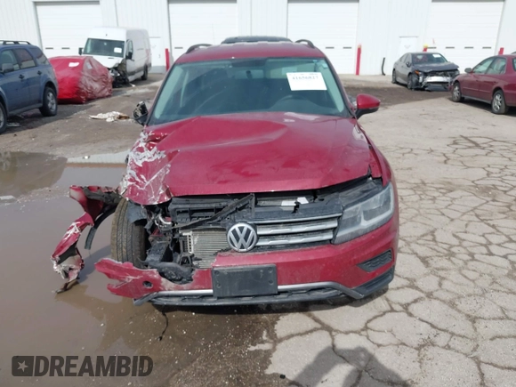 2018 Volkswagen Tiguan S with VIN 3VV1B7AX9JM085312, listed as a IAAI auction lot 41656827 with 122,322 mi miles and . Bid and sale history available at DreamBid. Image 12.