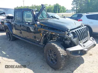 2023 Jeep Gladiator Sport S z VIN 1C6HJTAG2PL544870, wystawiony jako IAAI lot #42155013 z przebiegiem Nie podano mil oraz . Historia ofert i sprzedaży dostępna na DreamBid. Obrazek 1.