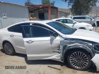 2017 Ford Fusion Titanium z VIN 3FA6P0SU0HR329224, wystawiony jako IAAI lot #42291605 z przebiegiem 176 728 mil mil oraz . Historia ofert i sprzedaży dostępna na DreamBid. Obrazek 14.