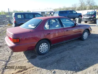 1996 Toyota Camry DX z VIN JT2BG12K4T0363844, wystawiony jako IAAI lot #42215996 z przebiegiem 214 452 mil mil oraz . Historia ofert i sprzedaży dostępna na DreamBid. Obrazek 4.