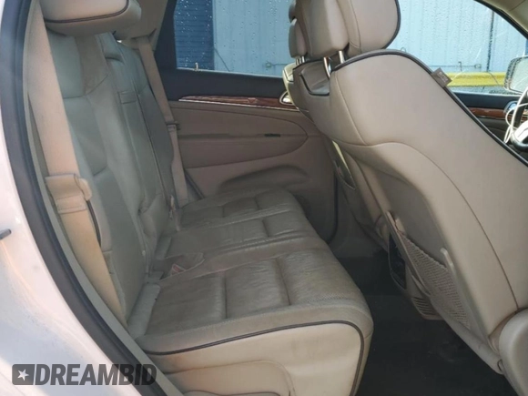 2013 Jeep Grand Cherokee Overland with VIN 1C4RJECG8DC526150, listed as a Copart auction lot 52038775 with 183,813 mi miles and Salvage Title. Bid and sale history available at DreamBid. Image 11.