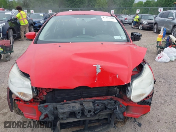 2012 Ford Focus SE z VIN 1FAHP3K23CL152488, wystawiony jako IAAI lot #42365769 z przebiegiem 185 763 mil mil oraz . Historia ofert i sprzedaży dostępna na DreamBid. Obrazek 13.