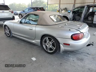 2004 Mazda MX-5 Miata LS z VIN JM1NB353X40404238, wystawiony jako Copart lot #61601895 z przebiegiem 110 549 mil mil oraz Szkoda całkowita • Salvage title. Historia ofert i sprzedaży dostępna na DreamBid. Obrazek 2.