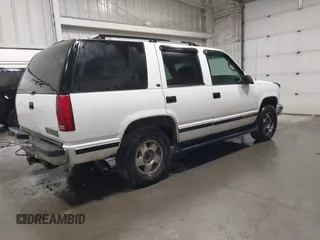 1999 Chevrolet Tahoe Z71 z VIN 1GNEK13R0XJ364222, wystawiony jako IAAI lot #41988710 z przebiegiem 204 577 mil mil oraz . Historia ofert i sprzedaży dostępna na DreamBid. Obrazek 4.