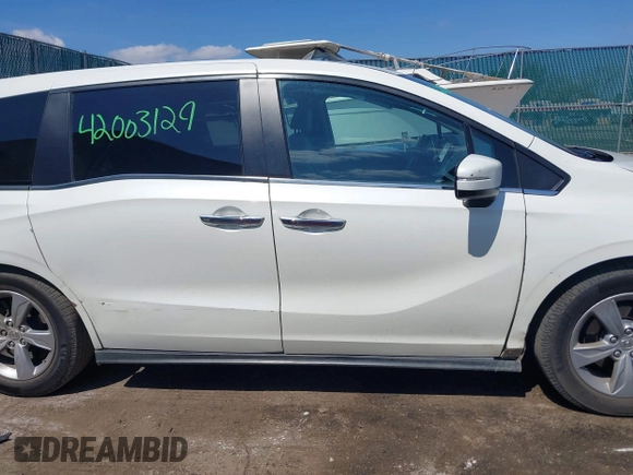 2018 Honda Odyssey EX-L z VIN 5FNRL6H70JB102713, wystawiony jako IAAI lot #42003129 z przebiegiem 410 500 mil mil oraz . Historia ofert i sprzedaży dostępna na DreamBid. Obrazek 13.