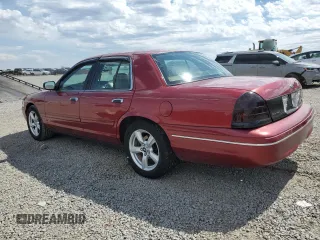 2003 Ford Crown Victoria LX z VIN 2FAFP74W43X100336, wystawiony jako Copart lot #51004035 z przebiegiem 82 089 mil mil oraz Szkoda całkowita • Salvage title. Historia ofert i sprzedaży dostępna na DreamBid. Obrazek 2.