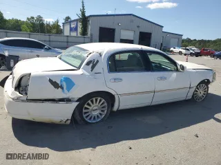 2004 Lincoln Town Car Signature with VIN 1LNHM81W04Y603672, listed as a Copart auction lot 52566725 with 214,180 mi miles and Salvage Title. Bid and sale history available at carsss.com. Image 3.