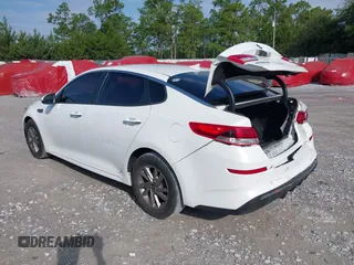 2020 Kia Optima LX with VIN 5XXGT4L30LG390927, listed as a IAAI auction lot 42642424 with 84,697 mi miles and . Bid and sale history available at DreamBid. Image 3.