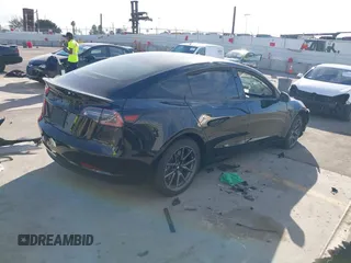 2019 Tesla Model 3 Mid Range with VIN 5YJ3E1EA0KF399082, listed as a IAAI auction lot 41697100 with 138,998 mi miles and . Bid and sale history available at carsss.com. Image 4.