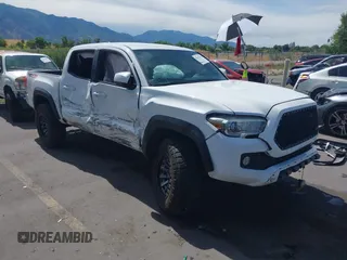 2016 Toyota Tacoma SR with VIN 5TFCZ5AN2GX022884, listed as a IAAI auction lot 42567482 with 180,079 mi miles and . Bid and sale history available at DreamBid. Image 1.