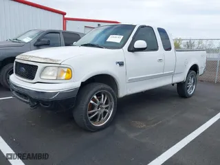 2000 Ford F-150 XL with VIN 1FTRX18W0YNA85809, listed as a IAAI auction lot 41848764 with 1 mi miles. Bid and sale history available at carsss.com. Image 2.