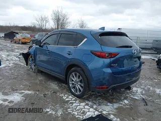 2020 Mazda CX-5 Grand Touring with VIN JM3KFBDM2L0778831, listed as a IAAI auction lot 41739655 with 72,533 mi miles. Bid and sale history available at carsss.com. Image 3.