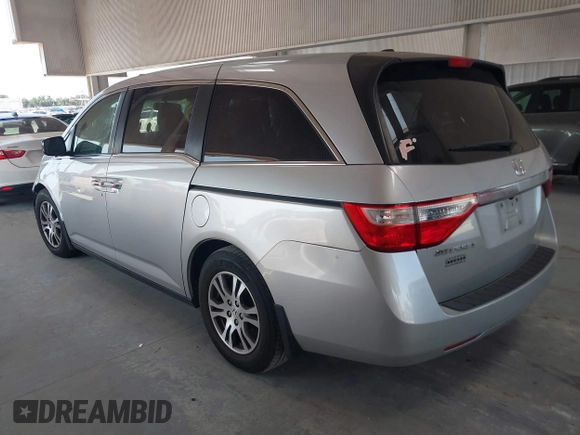 2012 Honda Odyssey EX-L with VIN 5FNRL5H67CB005013, listed as a IAAI auction lot 42295586 with 200,611 mi miles and . Bid and sale history available at DreamBid. Image 3.