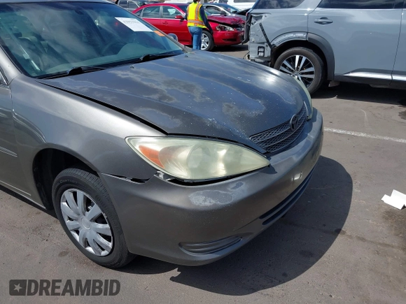 2004 Toyota Camry LE with VIN 4T1BE32K44U825561, listed as a IAAI auction lot 42051914 with 244,521 mi miles and . Bid and sale history available at DreamBid. Image 16.