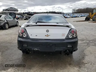2003 Hyundai Tiburon z VIN KMHHM65D53U042971, wystawiony jako Copart lot #86919434 z przebiegiem 202 250 mil mil oraz Szkoda całkowita • Salvage title. Historia ofert i sprzedaży dostępna na DreamBid. Obrazek 6.