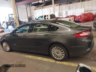 2016 Ford Fusion SE Hybrid with VIN 3FA6P0LU9GR235291, listed as a IAAI auction lot 41560312 with 112,777 mi miles. Bid and sale history available at carsss.com. Image 13.