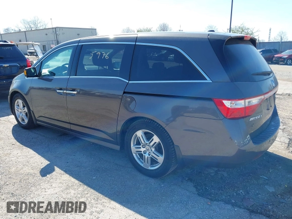 2012 Honda Odyssey Touring with VIN 5FNRL5H9XCB077351, listed as a IAAI auction lot 42045976 with 146,290 mi miles and . Bid and sale history available at DreamBid. Image 3.