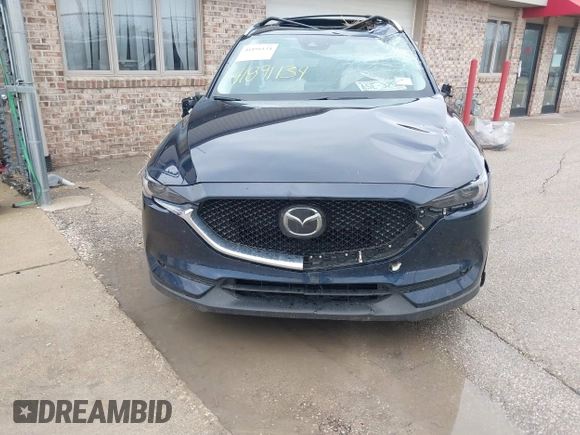 2018 Mazda CX-5 Grand Touring with VIN JM3KFADM1J1439544, listed as a IAAI auction lot 41891134 with 54,132 mi miles and . Bid and sale history available at DreamBid. Image 6.