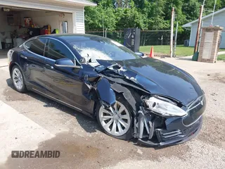 2014 Tesla Model S 60 with VIN 5YJSA1H17EFP65983, listed as a IAAI auction lot 42399288 with 166,365 mi miles and . Bid and sale history available at DreamBid. Image 1.