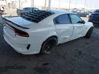 2023 Dodge Charger Scat Pack Widebody with VIN 2C3CDXGJ6PH635498, listed as a IAAI auction lot 41448100 with 13,678 mi miles and . Bid and sale history available at DreamBid. Image 4.