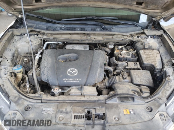2016 Mazda CX-5 Touring z VIN JM3KE2CY4G0805072, wystawiony jako Copart lot #58435535 z przebiegiem 146 323 mil mil oraz Szkoda całkowita • Salvage title. Historia ofert i sprzedaży dostępna na DreamBid. Obrazek 11.