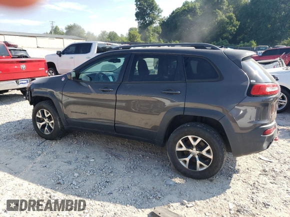 2014 Jeep Cherokee Trailhawk with VIN 1C4PJMBS1EW304718, listed as a Copart auction lot 64105485 with 151,315 mi miles and Salvage title. Bid and sale history available at DreamBid. Image 2.