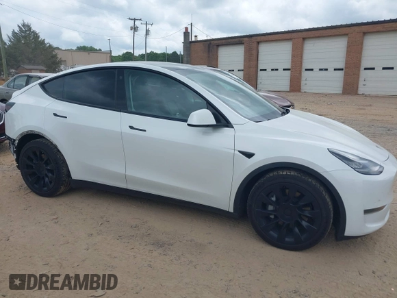 2021 Tesla Model Y Long Range with VIN 5YJYGDEE7MF198867, listed as a IAAI auction lot 42117463 with 79,759 mi miles and . Bid and sale history available at DreamBid. Image 13.