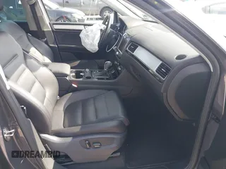 2011 Volkswagen Touareg Sport with VIN WVGFF9BP3BD002517, listed as a IAAI auction lot 42174143 with 156,337 mi miles and . Bid and sale history available at DreamBid. Image 5.