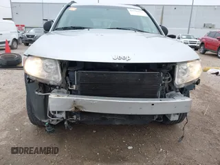 2011 Jeep Compass with VIN 1J4NT1FA7BD142600, listed as a IAAI auction lot 41590661 with 266,600 mi miles. Bid and sale history available at carsss.com. Image 6.