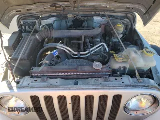 2003 Jeep Wrangler Rubicon z VIN 1J4FA69SX3P301962, wystawiony jako Copart lot #79928744 z przebiegiem Nie podano mil oraz Czysty tytuł • Clean title. Historia ofert i sprzedaży dostępna na DreamBid. Obrazek 11.
