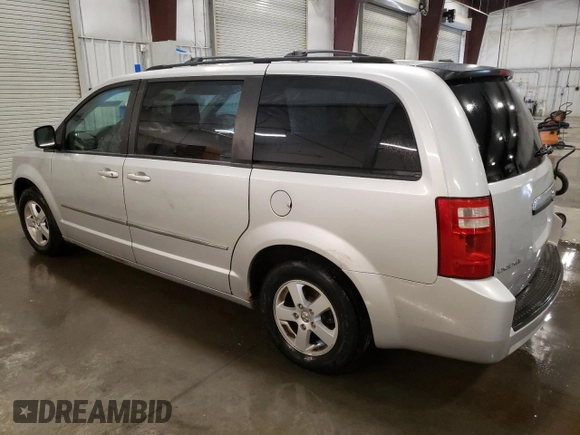 2010 Dodge Grand Caravan SXT with VIN 2D4RN5D19AR409665, listed as a Copart auction lot 46676445 with 174,063 mi miles and Salvage Title. Bid and sale history available at DreamBid. Image 2.