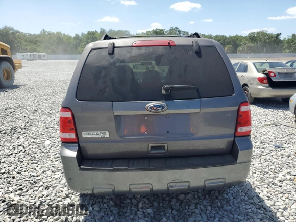 2010 Ford Escape XLT с VIN 1FMCU0D77AKA50940, выставлен на аукционе Copart как лот 55066975 с пробегом 169 940 миль миль и Списание • Salvage title. История ставок и продаж доступна на DreamBid. Изображение 6.