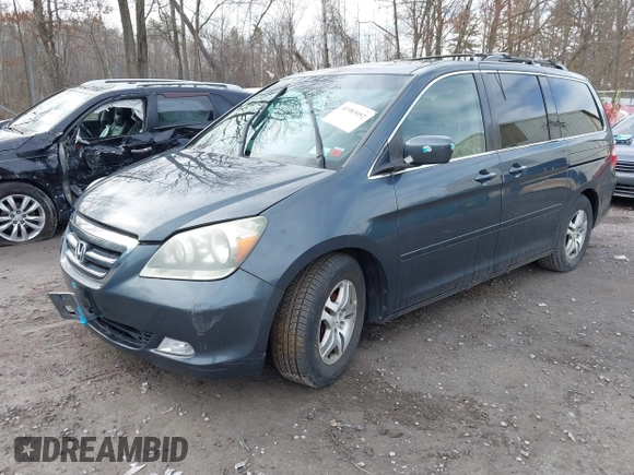 2005 Honda Odyssey EX-L with VIN 5FNRL38645B008281, listed as a IAAI auction lot 41985052 with 219,693 mi miles. Bid and sale history available at carsss.com. Image 2.