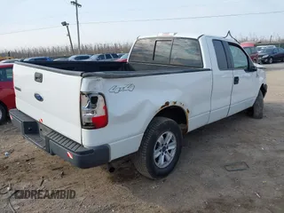 2005 Ford F-150 STX with VIN 1FTRX14W85FB72787, listed as a IAAI auction lot 41702370 with 210,544 mi miles. Bid and sale history available at carsss.com. Image 4.