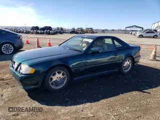 1994 Mercedes-Benz SL 5.0L with VIN WDBFA67E3RF091205, listed as a Copart auction lot 82210414 with 136,103 mi miles and Salvage title. Bid and sale history available at DreamBid. Image 1.