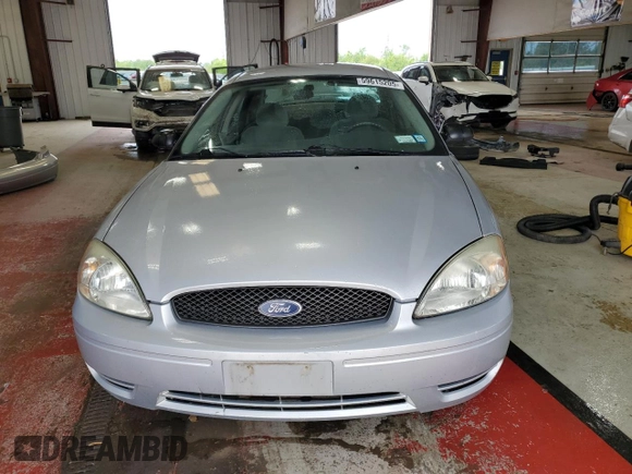 2005 Ford Taurus SE with VIN 1FAFP53215A133518, listed as a Copart auction lot 59615205 with 127,778 mi miles and Salvage title. Bid and sale history available at DreamBid. Image 5.