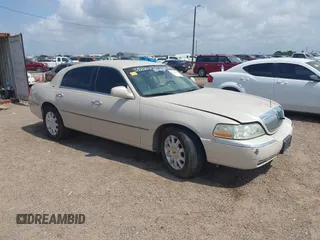 2003 Lincoln Town Car Cartier z VIN 1LNHM83W03Y634724, wystawiony jako IAAI lot #42283178 z przebiegiem Nie podano mil oraz . Historia ofert i sprzedaży dostępna na DreamBid. Obrazek 1.