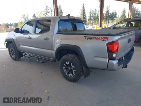 2018 Toyota Tacoma SR with VIN 3TMCZ5ANXJM146284, listed as a IAAI auction lot 42041525 with 103,143 mi miles and . Bid and sale history available at DreamBid. Image 3.