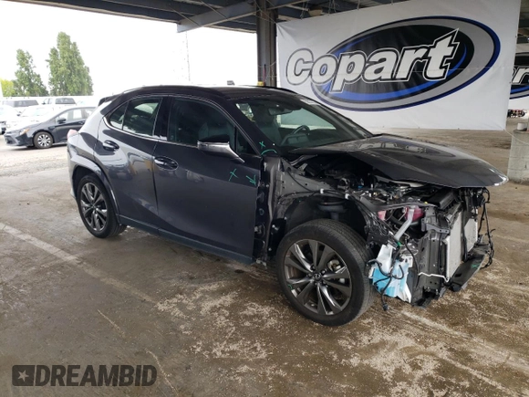 2023 Lexus UX 250h F Sport with VIN JTHB9JBHXP2065586, listed as a Copart auction lot 59037755 with 23,620 mi miles and Salvage title. Bid and sale history available at DreamBid. Image 4.