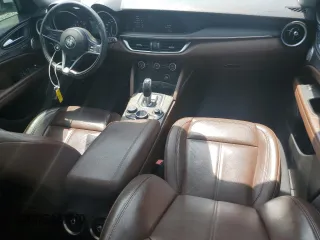 2018 Alfa Romeo Stelvio Ti z VIN ZASFAKBN8J7B79495, wystawiony jako Copart lot #55599025 z przebiegiem 143 606 mil mil oraz Szkoda całkowita • Salvage title. Historia ofert i sprzedaży dostępna na DreamBid. Obrazek 8.