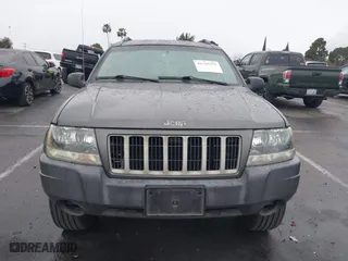 2004 Jeep Grand Cherokee Laredo with VIN 1J4GX48S14C177923, listed as a IAAI auction lot 41745772 with 242,506 mi miles. Bid and sale history available at carsss.com. Image 12.