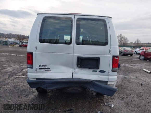 2013 Ford Econoline Cargo Commercial with VIN 1FTNE1EW2DDB11061, listed as a IAAI auction lot 41808318 with 230,677 mi miles. Bid and sale history available at carsss.com. Image 6.