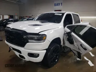 2023 Ram 1500 Laramie with VIN 1C6SRFRT8PN666638, listed as a Copart auction lot 41448335 with 23,811 mi miles and Salvage title. Bid and sale history available at DreamBid. Image 1.