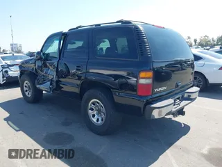 2002 GMC Yukon SLT with VIN 1GKEC13T92R162978, listed as a IAAI auction lot 41851599 with 213,789 mi miles. Bid and sale history available at carsss.com. Image 3.