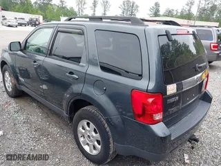 2008 Mazda Tribute Touring with VIN 4F2CZ02ZX8KM25983, listed as a IAAI auction lot 42122836 with 148,080 mi miles. Bid and sale history available at carsss.com. Image 3.