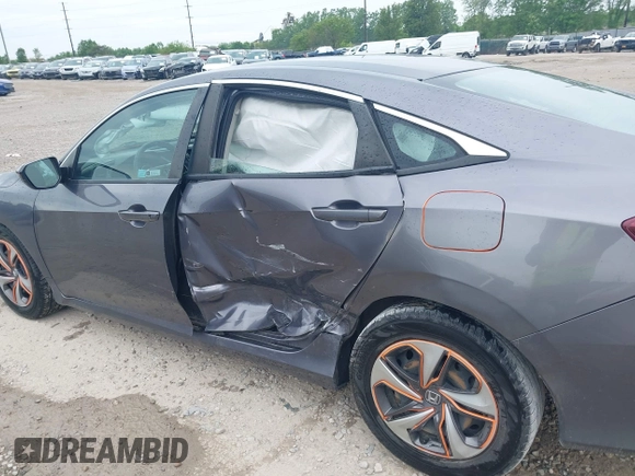 2020 Honda Civic LX z VIN 19XFC2F66LE012481, wystawiony jako IAAI lot #42297600 z przebiegiem 56 602 mil mil oraz . Historia ofert i sprzedaży dostępna na DreamBid. Obrazek 6.